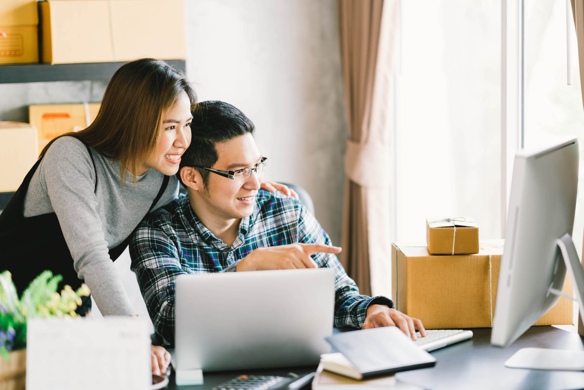 Young couple looking at computer monitor